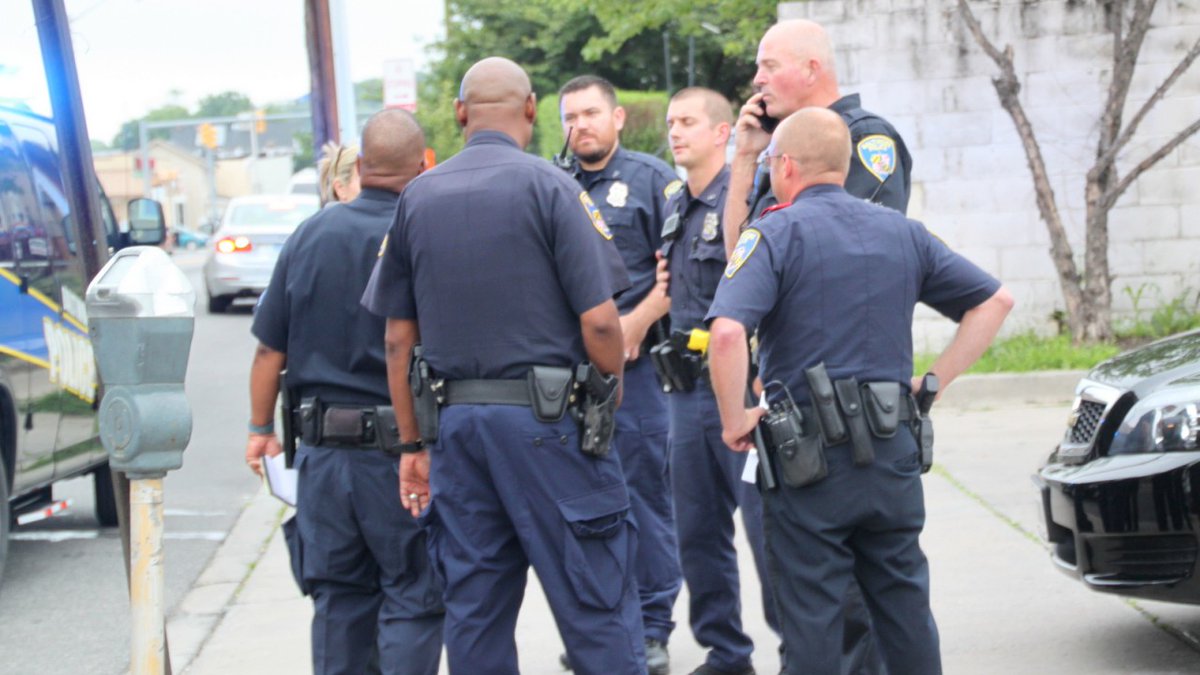 Baltimore Police officers gather in Hampden last June following a potential disturbance. (Fern Shen)