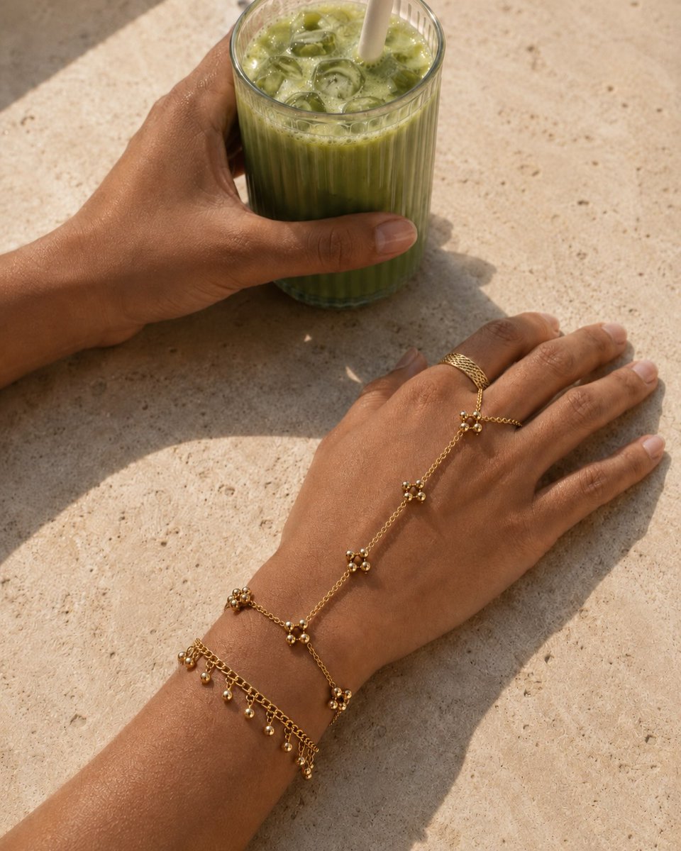AssViviane's tweet photo. Some days need only sun, iced matcha, and the pieces you reach for without thinking. Ravi Hand Chain + Ravi Bracelet, made for the everyday, not just the occasion. https://t.co/kmMckWSx00