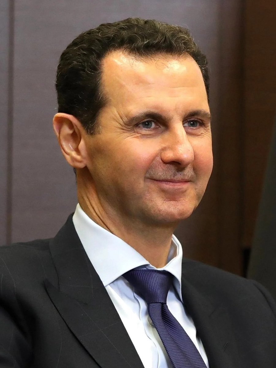 EdbieLigerSmith's tweet photo. Bashar Al-Assad was far from being a perfect leader, and I’ve stated my criticisms of his former Government many times.

However, the current turmoil in Syria really gets to the heart of why so many of us believed the fall of the Ba’athist Socialist State was a tragedy.

The Assad family did not enact major land redistribution, which I believe was a mistake, but they did utilize methods of central economic planning such as petroleum subsidies & state issued fuel prices in order to keep gas prices down & spur economic development.

After the Assad Government fell the economy was liberalized, which is a fancy way of saying it was handed over to private interests who don’t give two shits about the Syrian people. 

Over 100 state run companies were privatized & the IMF is now working directly in Syria’s Finance Ministry, molding their “economic recovery” in a way that is beneficial to the profits of Western/Gulf corporations and banks.

Now people are being hit with a 40% increase in fuel prices at a time when the country is divided into factions & the central Government lacks the ability & the will to unify the country.

Chaos has erupted and Syria now risks falling into the state of anarchy and civil war that Libya did after the overthrow of Gaddafi.

And as with Libya, the main beneficiaries of such a disaster would undoubtably be the US and Israel.

In my view, the people who’s analysis of this conflict can be summarized in two words, “Assad bad” are not giving you the full picture, and those who characterize it as nothing more than a religious conflict are missing the underlying economic situation, including the goals of the US empire in Syria.