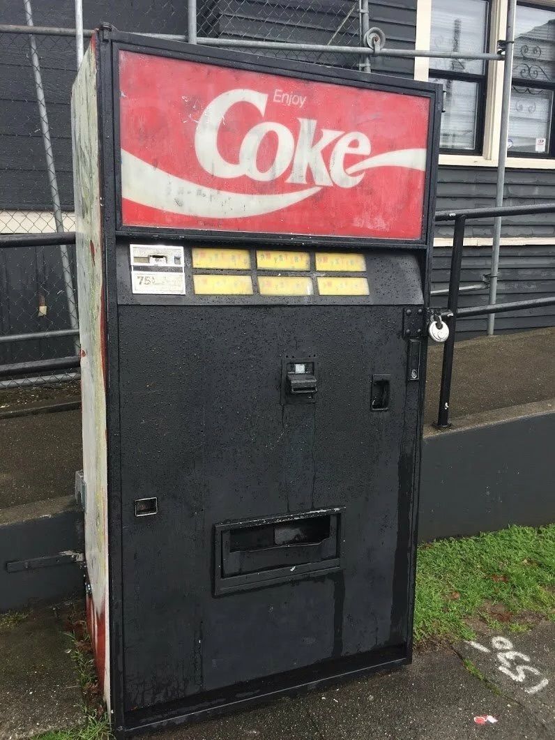 internetpreai's tweet photo. the capitol hill seattle mystery vending machine

the vending machine, with all buttons labelled "mystery", often served random discontinued drinks. it is unknown who was responsible for restocking the machine, leading to the development of a local legend that it was haunted.

the machine was located on east john street in seattle. it was a branded coca cola machine but dispensed drinks from many different manufacturers. The drinks dispensed were typically unusual flavours that were no longer being manufactured. 

in 2012, a short film was produced taking inspiration from the mystery of the machine.

on 29 June 2018, the machine disappeared following work done on the nearby bus stop and sidewalk, with a note left nearby reading "went for a walk"