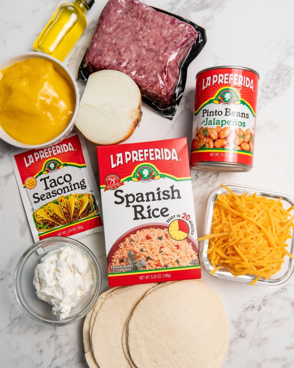 rechelove's tweet photo. A delicious new recipe drops Friday. Can you guess it from these ingredients: Spanish rice, nacho cheese, ground beef, taco seasoning, pinto beans, tortillas, shredded cheese, sour cream and jalapeños? Share your guess below. https://t.co/aQ82R2ndGa