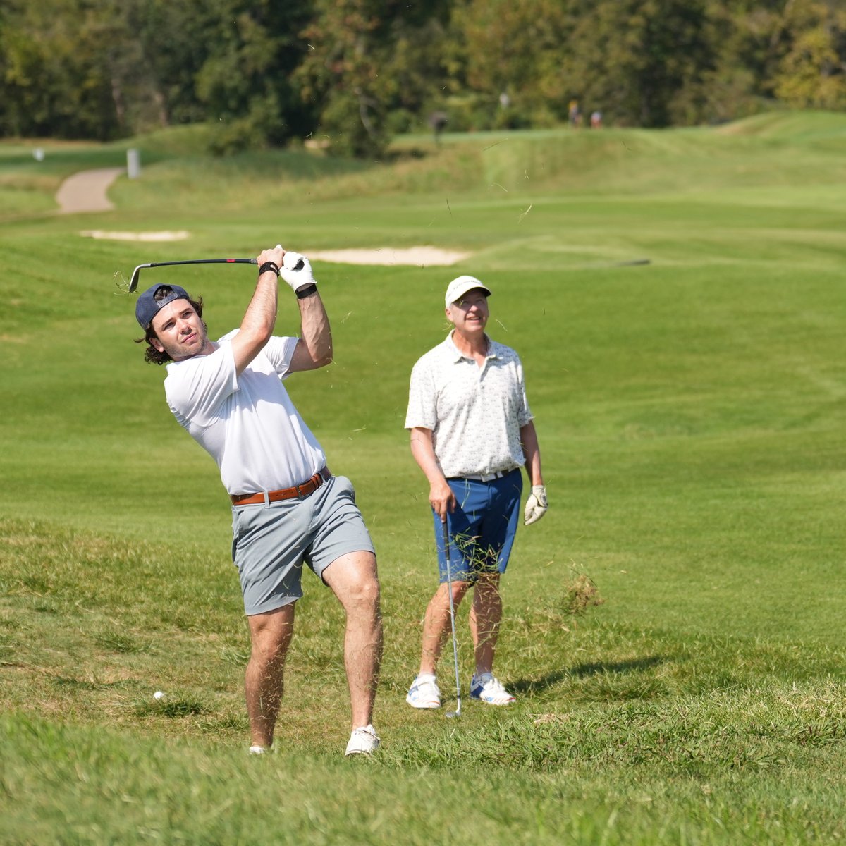 Image of Mavrik Bourque taking a swing on the golf course