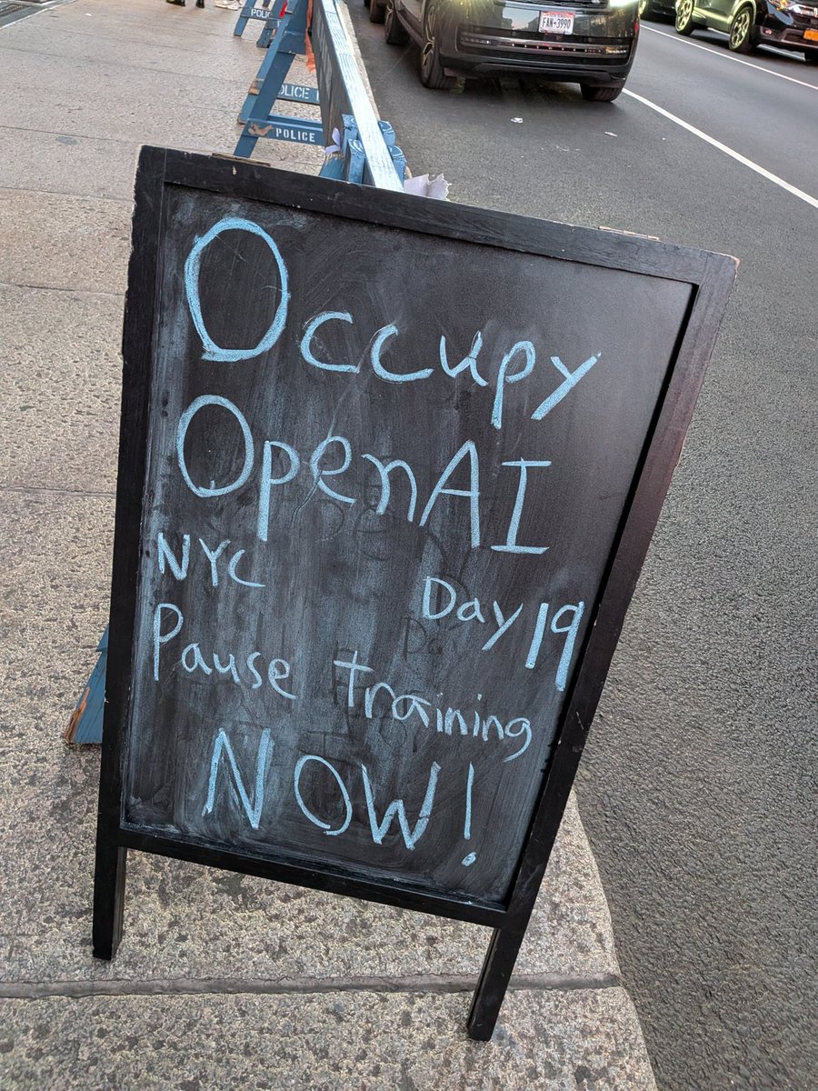 canadabirdie's tweet photo. Day 19 of occupying OpenAI's NYC offices until OpenAI pauses frontier model training

I have updated the demand in light of the severity of the situation. OpenAI (and all AI companies) needs to unilaterally pause frontier model training immediately. Any new model could be the one that kills us

- Met and had good conversations with a few more employees 
- Changed a conservative guy's mind about existential risk (he appreciated the framing of "we order China to stop too, and if they don't, we bomb them")
- Tried out livestreaming for the first time. It makes people less likely to want to talk, so a bit of a mixed bag

Good day