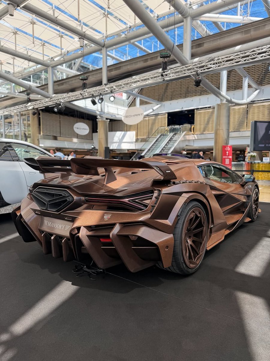 Elitecargasm's tweet photo. The MANSORY Carbonado X. 🦈

6.5L naturally aspirated V12.
1,120 hp.
355 km/h.
0–100 km/h in just 2.3 seconds.

The entire bodywork is made from carbon fibre.

And it’s a one-off.

Would you take this over a stock Revuelto? 👀 https://t.co/f0xaNwkrQ8