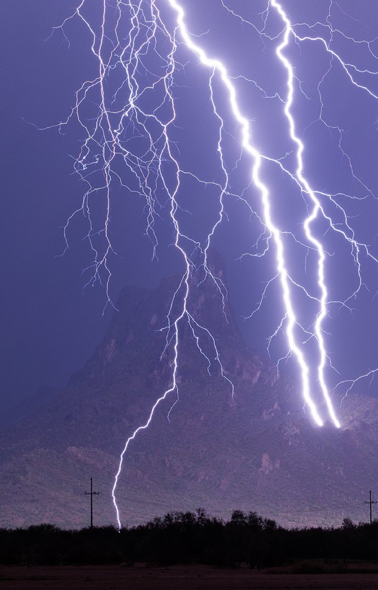 MikeOlbinski's tweet photo. Absolutely floored to capture this tonight. The storm was pretty much done and this was likely a clear air death bolt but good grief what a doozy of a burst of electricity. Always wanted landing points on Picacho Peak but this was something else. #azwx https://t.co/R6dkYhK8tT