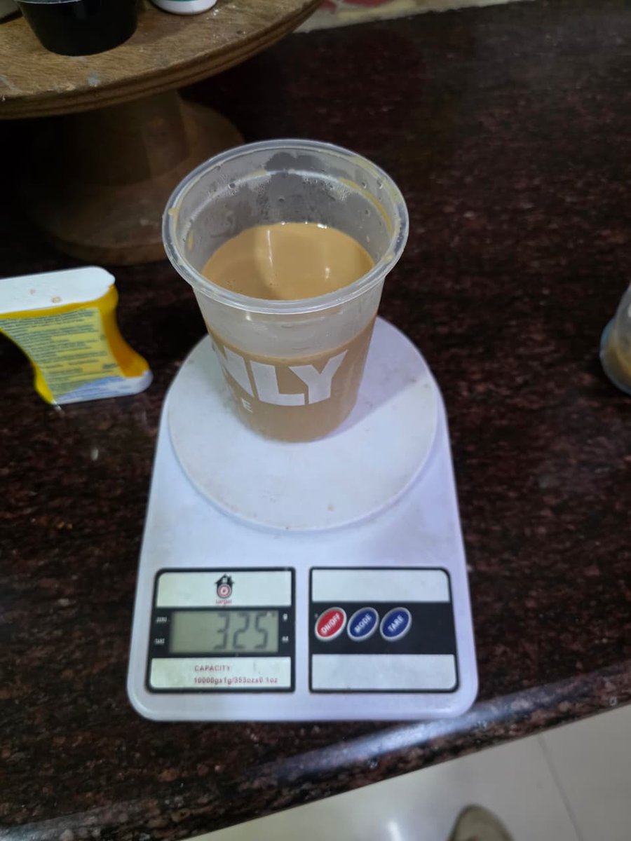 TheChaiDude's tweet photo. I usually don't do maths. But when I do, it is to call out the fast one @Swiggy and #Beanly Coffee tried to pull on me. But much to their annoyance. You made someone who calls himself "The Chai Dude" rant about Coffee!
I have a lazy Tuesday today. I did the math, so you did not have to.
I ordered 500 ml Latte from #Beanly on @SwiggyCares. The cup looked quite small. I did not have a 500 ml or a 1L cup lying around. So, I decided to calculate.
Step 1: Calculating the Average Density of the Liquid
Latte has 3 part Milk and 1 part espresso (essentially water).
Density of toned milk: ~1.03 g/ml
Density of plain water: 1.00 g/ml
Ratio: 3 parts milk to 1 part water (4 parts total)
The Blend:
(3 parts milk × 1.03) + (1 part water × 1.00) = 3.09 + 1.00 = 4.09
Average Density = 4.09 / 4 total parts
Average Density = 1.0225 g/ml
Step 2: Calculate the Volume of the Liquid
Then I determined how much space the liquid itself takes up, independent of the ice.
Net mass of the liquid: 325 g (Picture attached)
Formula: Volume = Mass / Average Density
The Math:
Volume = 325 g / 1.0225 g/ml
Liquid Volume = 317.85 ml
Shortfall: 182.15 ml
Where is the 182.15 ml of coffee @Swiggy?
Considering Ice volume
Step 3: Calculate the Mass and Volume of the Ice
Ice has a lower density than liquid water (which is why it floats), meaning a specific mass of ice takes up slightly more space than the same mass of water.
Density of solid ice: ~0.917 g/ml
Total mass of contents: 395 g
Mass of liquid: 325 g
Mass of Ice = Total Mass - Liquid Mass
Mass of Ice = 395 g - 325 g = 70 g of ice
The Math for Volume:
Volume of Ice = Mass of Ice / Density of Ice
Volume of Ice = 70 g / 0.917 g/ml
Ice Volume = 76.36 ml
Step 4: Calculate the Total Volume and the Shortfall
Finally, I added the liquid volume and the ice volume together to see exactly how much of the 500 ml cup was actually filled.
The Math for Total Volume:
Total Volume = Liquid Volume + Ice Volume
Total Volume = 317.85 ml + 76.36 ml
Total Volume in Cup = 394.21 ml
The Math for Shortfall:
Shortfall = Ordered Volume - Actual Total Volume
Shortfall = 500 ml - 394.21 ml
Total Missing Volume = 105.79 ml
TLDR: Without Ice, I was shortchanged by 182.15 ml of coffee.
With ice, I was shortchanged by 105.79 ml of coffee.
I need answers @Swiggy