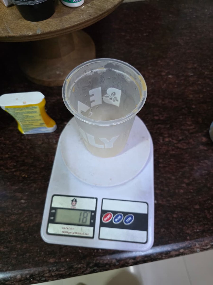 TheChaiDude's tweet photo. I usually don't do maths. But when I do, it is to call out the fast one @Swiggy and #Beanly Coffee tried to pull on me. But much to their annoyance. You made someone who calls himself "The Chai Dude" rant about Coffee!
I have a lazy Tuesday today. I did the math, so you did not have to.
I ordered 500 ml Latte from #Beanly on @SwiggyCares. The cup looked quite small. I did not have a 500 ml or a 1L cup lying around. So, I decided to calculate.
Step 1: Calculating the Average Density of the Liquid
Latte has 3 part Milk and 1 part espresso (essentially water).
Density of toned milk: ~1.03 g/ml
Density of plain water: 1.00 g/ml
Ratio: 3 parts milk to 1 part water (4 parts total)
The Blend:
(3 parts milk × 1.03) + (1 part water × 1.00) = 3.09 + 1.00 = 4.09
Average Density = 4.09 / 4 total parts
Average Density = 1.0225 g/ml
Step 2: Calculate the Volume of the Liquid
Then I determined how much space the liquid itself takes up, independent of the ice.
Net mass of the liquid: 325 g (Picture attached)
Formula: Volume = Mass / Average Density
The Math:
Volume = 325 g / 1.0225 g/ml
Liquid Volume = 317.85 ml
Shortfall: 182.15 ml
Where is the 182.15 ml of coffee @Swiggy?
Considering Ice volume
Step 3: Calculate the Mass and Volume of the Ice
Ice has a lower density than liquid water (which is why it floats), meaning a specific mass of ice takes up slightly more space than the same mass of water.
Density of solid ice: ~0.917 g/ml
Total mass of contents: 395 g
Mass of liquid: 325 g
Mass of Ice = Total Mass - Liquid Mass
Mass of Ice = 395 g - 325 g = 70 g of ice
The Math for Volume:
Volume of Ice = Mass of Ice / Density of Ice
Volume of Ice = 70 g / 0.917 g/ml
Ice Volume = 76.36 ml
Step 4: Calculate the Total Volume and the Shortfall
Finally, I added the liquid volume and the ice volume together to see exactly how much of the 500 ml cup was actually filled.
The Math for Total Volume:
Total Volume = Liquid Volume + Ice Volume
Total Volume = 317.85 ml + 76.36 ml
Total Volume in Cup = 394.21 ml
The Math for Shortfall:
Shortfall = Ordered Volume - Actual Total Volume
Shortfall = 500 ml - 394.21 ml
Total Missing Volume = 105.79 ml
TLDR: Without Ice, I was shortchanged by 182.15 ml of coffee.
With ice, I was shortchanged by 105.79 ml of coffee.
I need answers @Swiggy