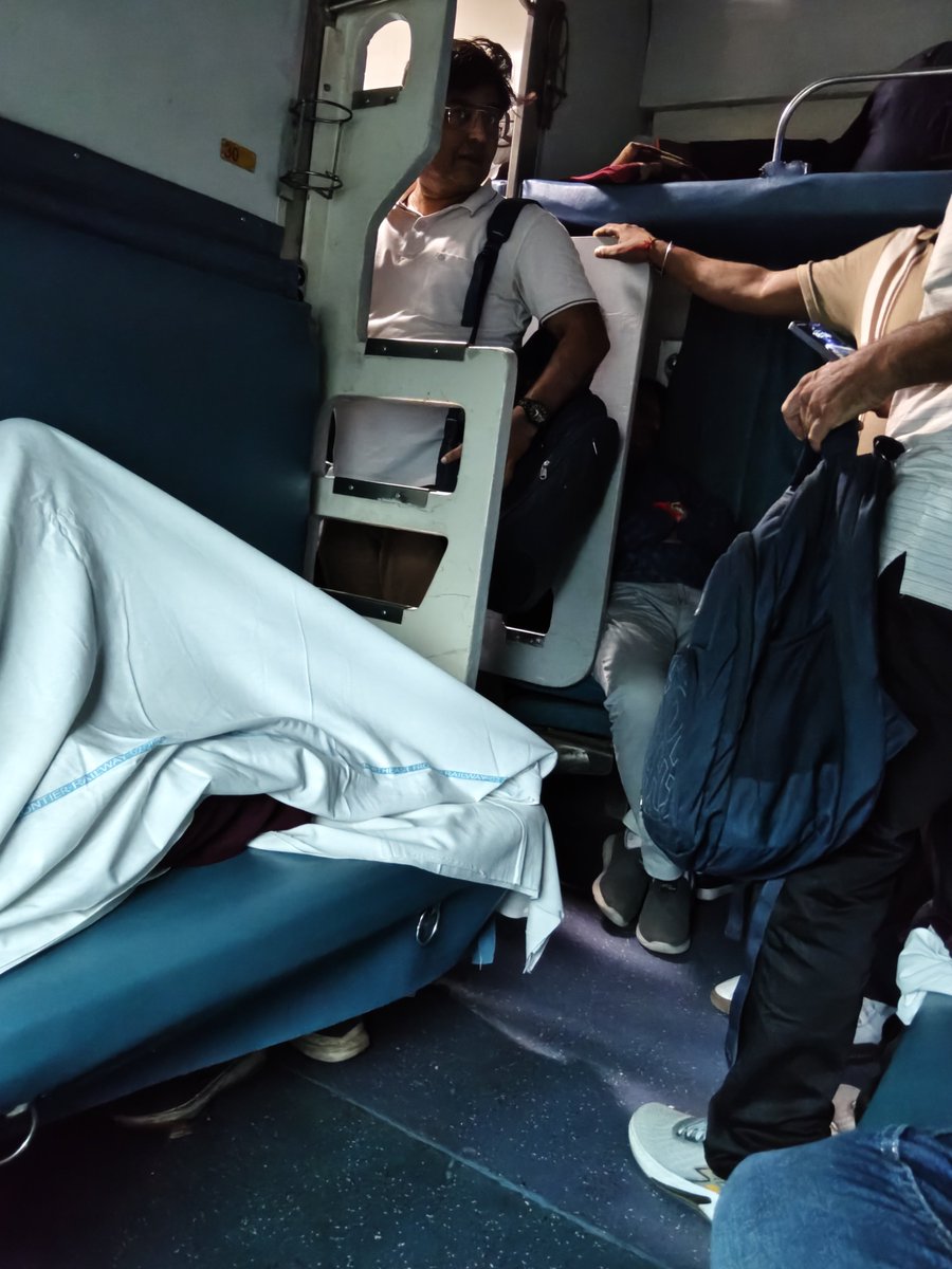 abdulmannan_003's tweet photo. @RailwaySeva @RailMinIndia  15909, after delhi 3AC becomes general, loaded with locals. B5. they are forcing me to give up my seat as they will go 2-3 station for free in AC. TT is nowhere https://t.co/E4ANj0qtwV
