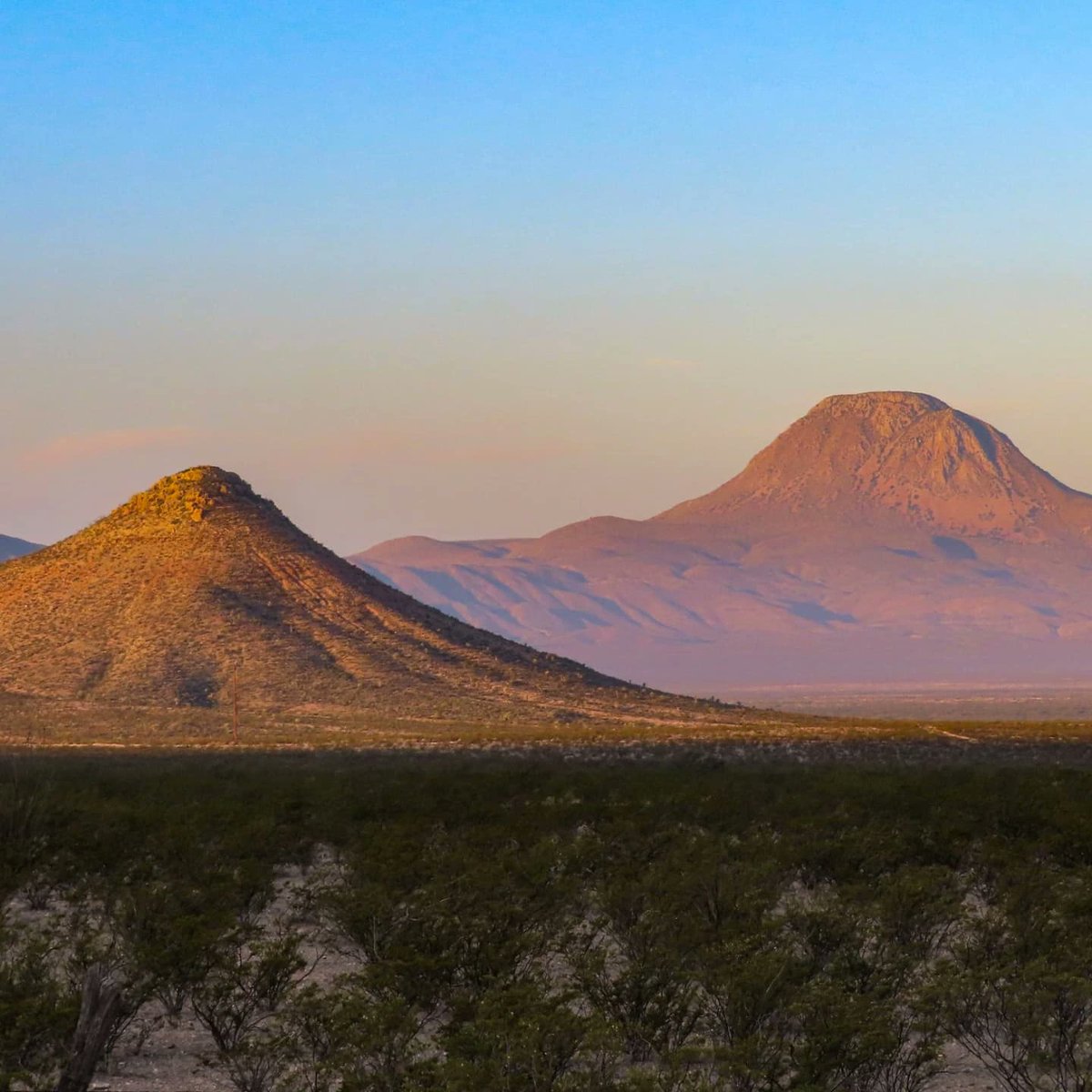 NorrisCroabr's tweet photo. Entering Big Bend National Park at sunrise via TX 385 from the north. Layered clouds, mist, and fog create a chiaroscuro blend of light and shadow in the morning’s golden hour. https://t.co/qzWeKV1pK0