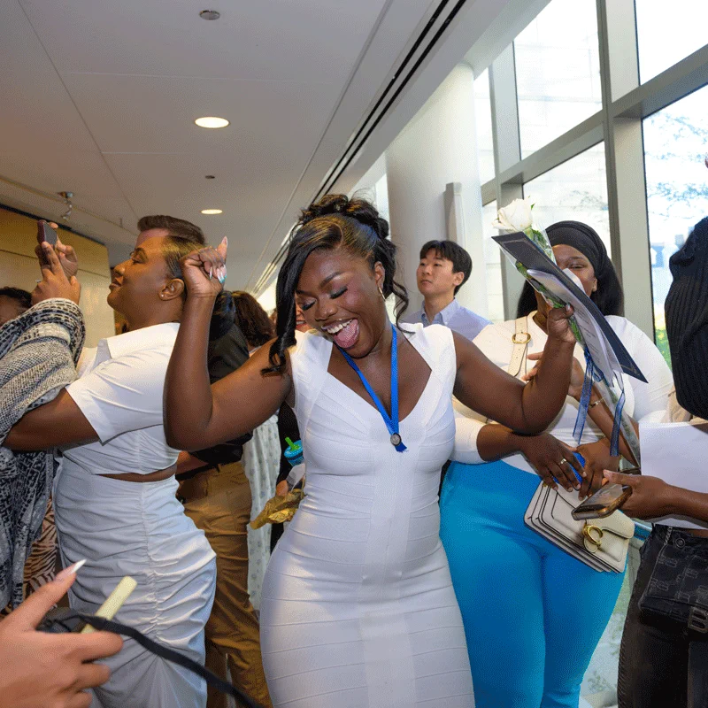 Student celebrating after Pinning Ceremony