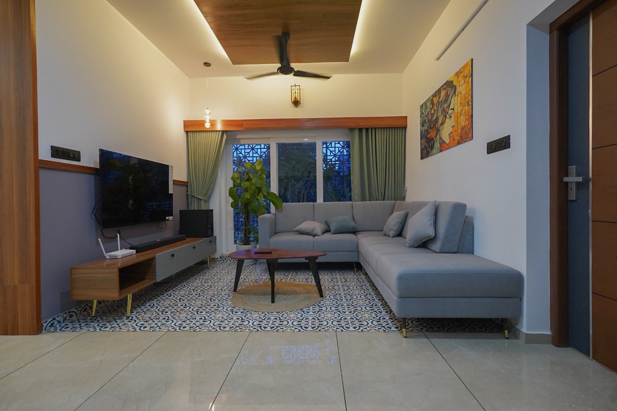 GilmaDicker5's tweet photo. A thoughtfully designed living room blending warm wood tones, soft textures, statement art, and natural light—creating an effortlessly inviting space in Chavara. https://t.co/tbesjBZh2e