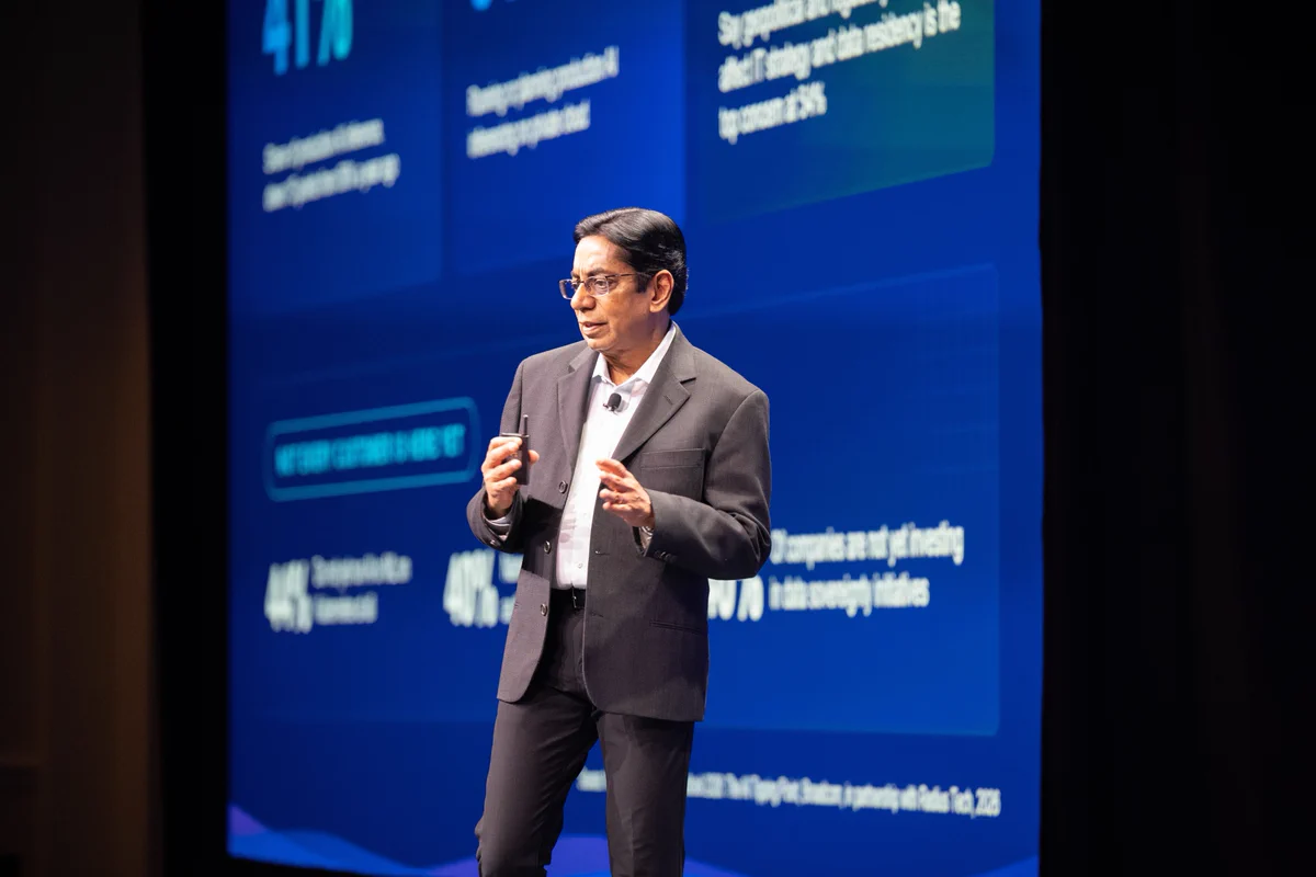 A person presenting on VMware Explore stage.