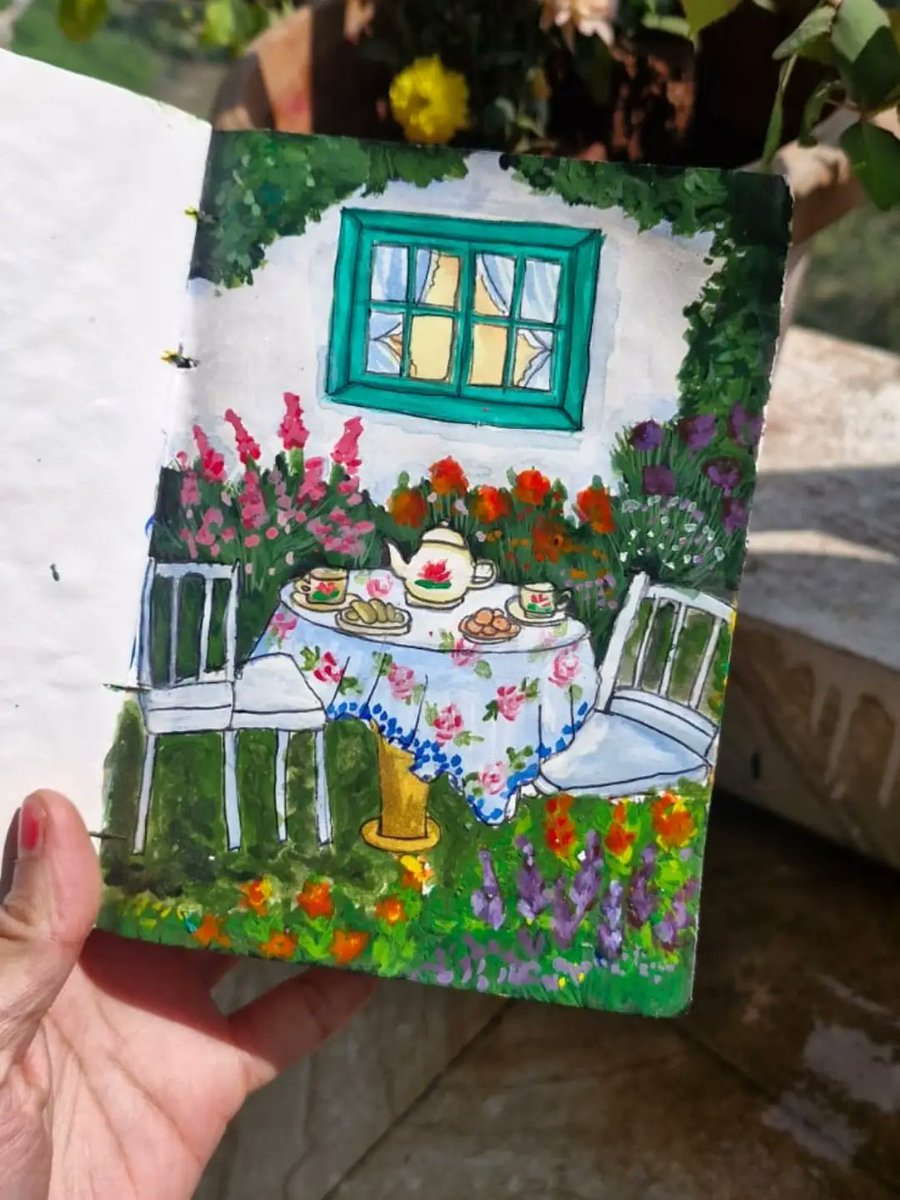 CamiMackenzie's tweet photo. A cozy table beneath open skies, surrounded by a blooming garden. https://t.co/O6TQX7plOa