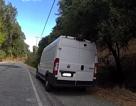 Suspicious van on the side of the road.