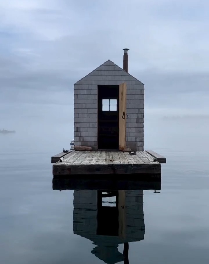 sosa_mi's tweet photo. Floating calmly in the harbor off Little Cranberry Island, Maine, is a cedar-shingled sauna designed by Brendan Ravenhill. Friends and family helped build the structure during a single summer, creating a compact timber-framed hybrid of Scandinavian s... https://t.co/EkgTsWc42P