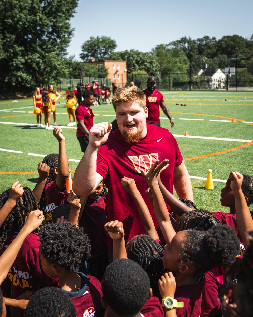 Photo of Matt Gulbin breaking down a huddle.