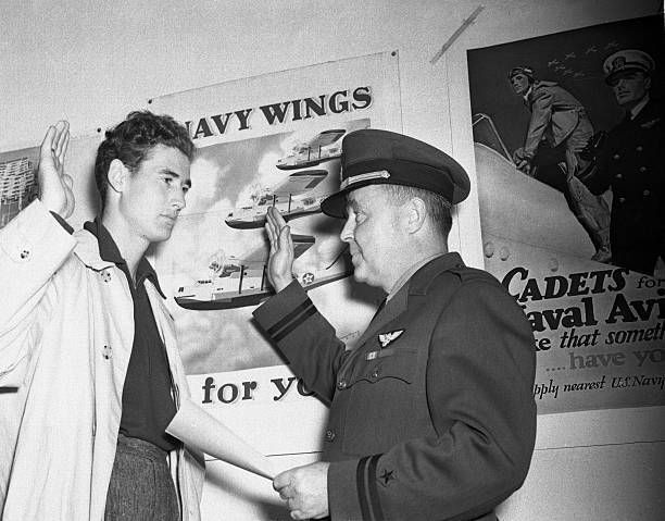 baseballinpix's tweet photo. Ted Williams is sworn in as a naval aviation cadet by Lt. F. T. Donahue, 1942. Photo by Bettman. 

He enlisted, earned his wings, and missed three full seasons during World War II. He came back in 1946 and won the AL MVP. Then in 1952, at 33 and still in his prime, the Marines recalled him for Korea. He flew 39 combat missions as a fighter pilot, survived a crash landing in a burning jet, and served as John Glenn's wingman. He returned to baseball in August 1953 and homered in his first at-bat.