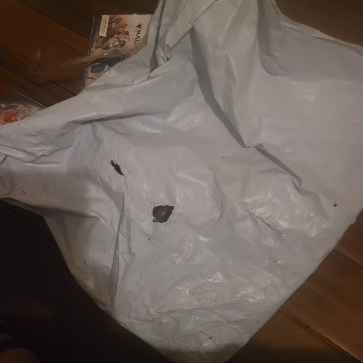 battlemtga's tweet photo. @MTG_Arena @wizards_magic Arena Direct shipment showed up in a torn plastic bag with multiple sealed boxes crushed. Second damaged shipment in a row, and support has now gone 10 days without responding to my escalation. https://t.co/EZ7ZCg5J28
