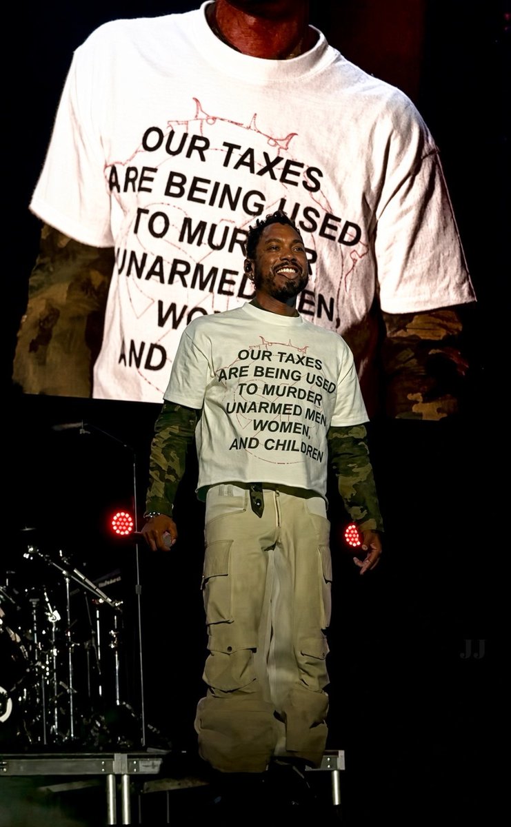 JimmyJ4thewin's tweet photo. 🎤 Mexican-American singer Miguel took the stage in Long Beach last weekend wearing a shirt that called out our tax dollars being used to target innocent lives in Congo, Sudan, Palestine, and beyond. https://t.co/g5MtR1vmWt