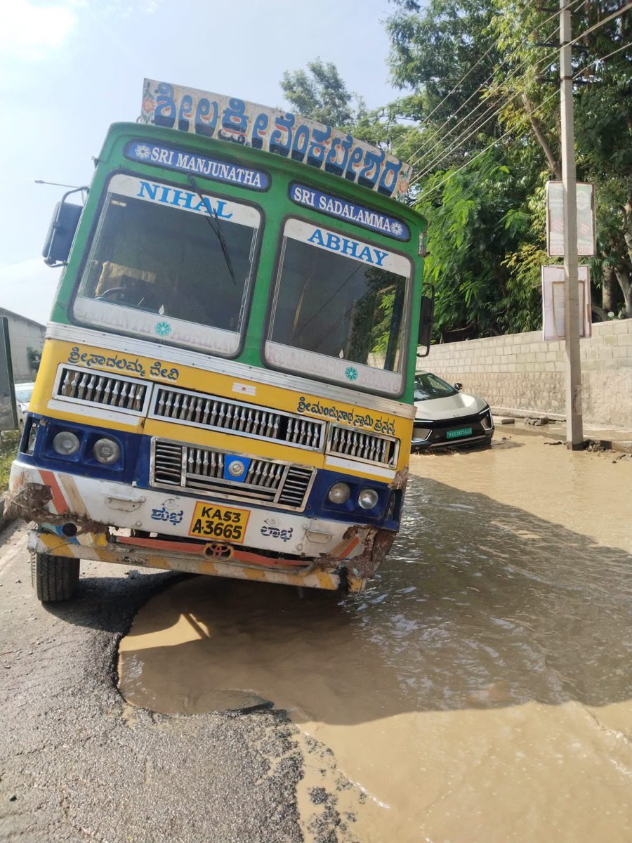 BudigereX's tweet photo. Budigere Rd near Sattva Songbird apartments : trucks stuck in potholes, rainwater hiding the danger. How has this road deteriorated within a few years?

@krishnabgowda @CMofKarnataka Please ensure lasting repairs, drainage and a deadline. Who is accountable for the quality? https://t.co/7l205B95YZ