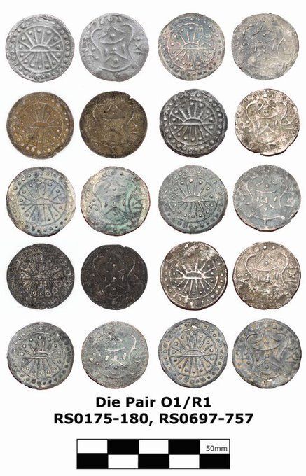 Several silver coins. On one side is the image of a rising sun, on the other a flowing, geometric pattern (Srivatsa).