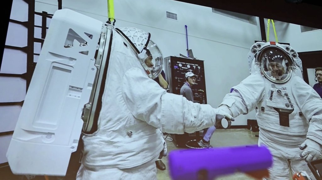CommanderMLA's tweet photo. The AxEMU is designed to be both a walking suit and for use in microgravity.  During testing we are often suspended by a weight relief system for practical and safety reasons. For some reason, the weight relief system is called Howard. So every time we want to be raised or lowered, we say 'Up Howard' or 'Down Howard.’ It's good to have a little levity in the middle of high stakes engineering 🙂