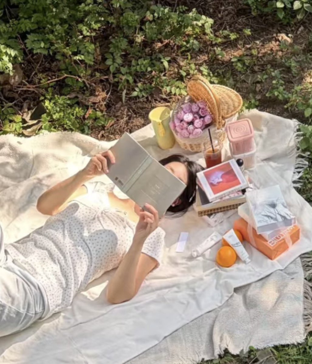daeportrait's tweet photo. guys, look at this cute update from Sodam 🥹 
Shiny Foundation is doing a photoshoot for the hand creams i think, and she’s reading the skeleton flower book and next to her are the two poet artist albums🤍🥹 https://t.co/XwvZgEezf7