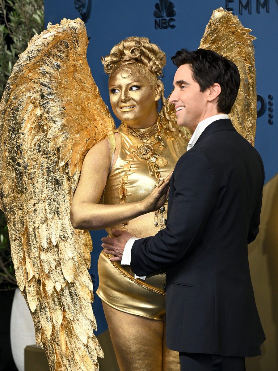 luresmagazine's tweet photo. Meg Stalter turned heads at the 2026 Emmys by showing up fully gilded as a living Emmy statuette alongside Paul W. Downs, delivering one of the most iconic and creative red carpet moments of the night.
#Lures #MegStalter #PaulDowns #Emmys2026 https://t.co/JgatKaFwbz