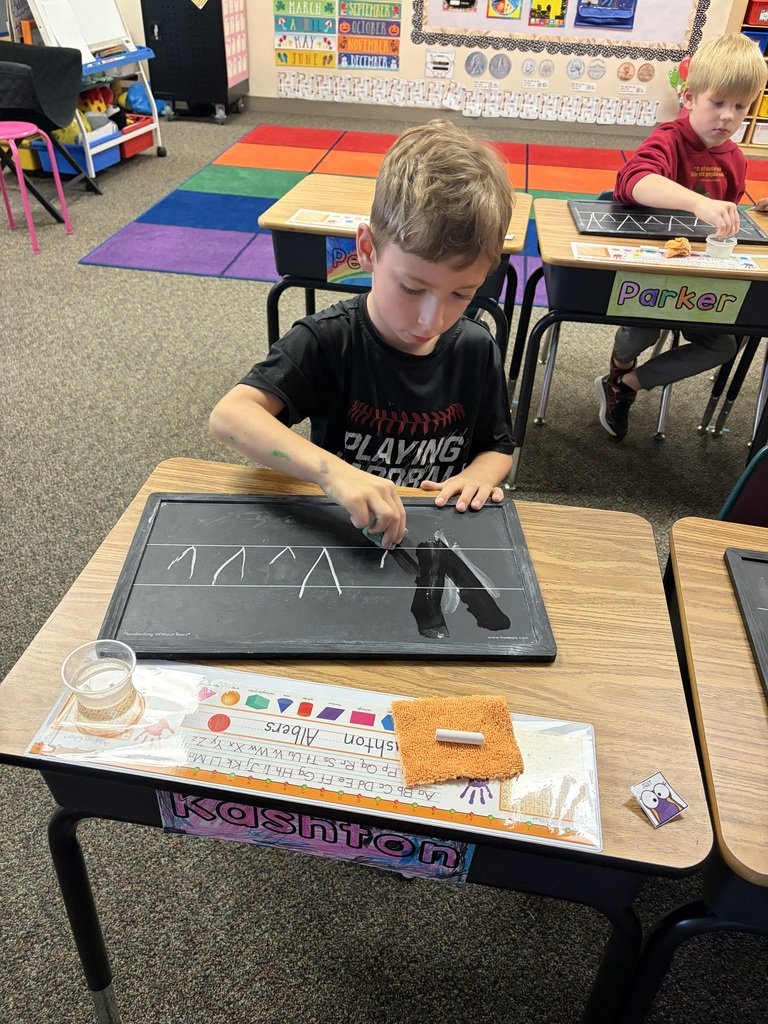 SQThomasElem's tweet photo. Our first graders had fun practicing their handwriting on chalkboards today! ✏️ They worked hard on letter formation while enjoying a fun change from pencil and paper. 💛 https://t.co/M1P17L7HZA