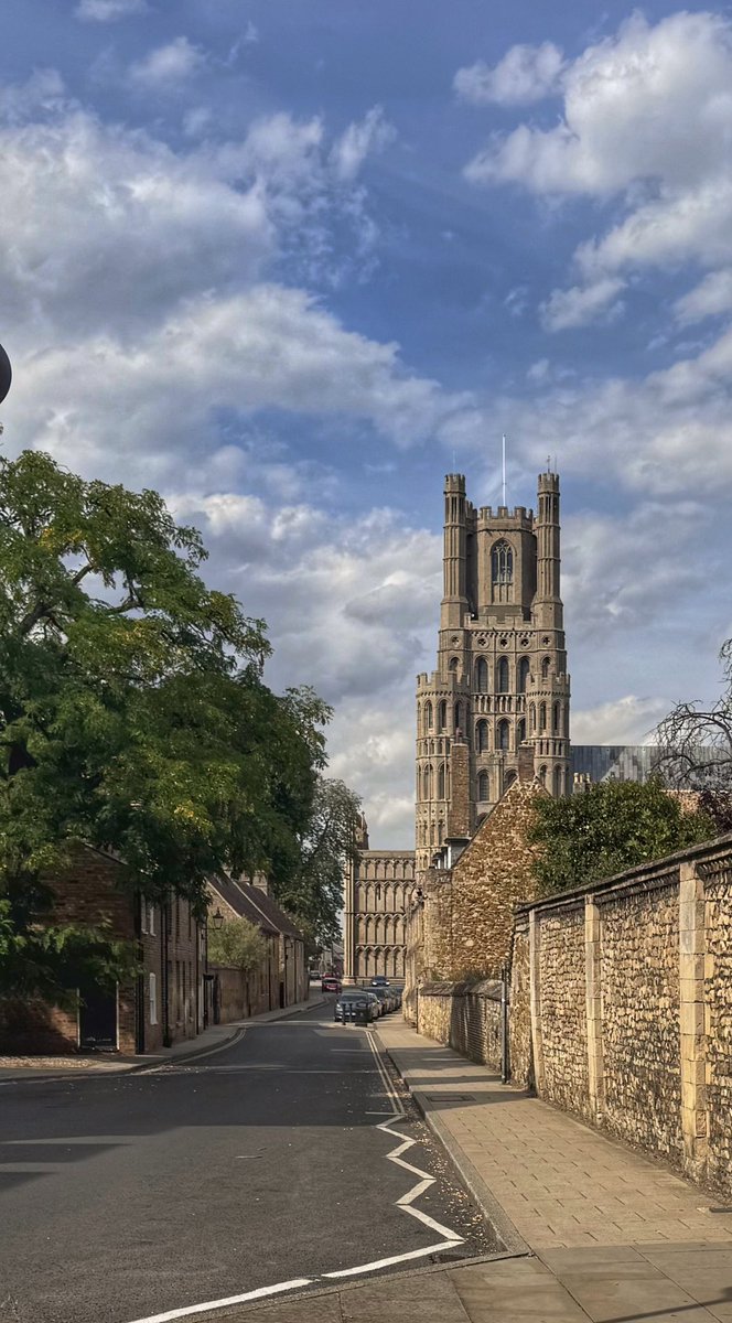 ullipix's tweet photo. Ely Cathedral - down the road, grand and golden... and then peeking through the trees, quiet and green. Different angles, same magic. #ElyCathedral #Cambridgeshire #England #MomentsAndPlaces #Ullipix #EnglishSummer https://t.co/oX68jUOzev