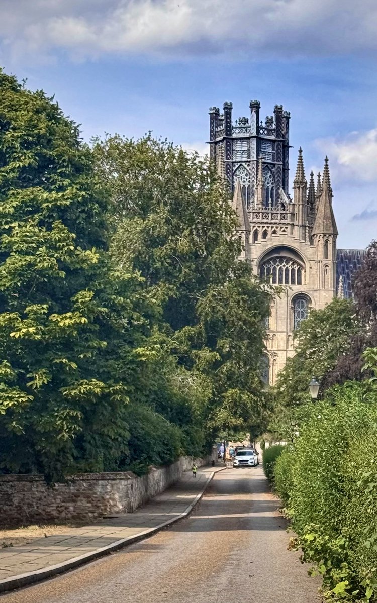 ullipix's tweet photo. Ely Cathedral - down the road, grand and golden... and then peeking through the trees, quiet and green. Different angles, same magic. #ElyCathedral #Cambridgeshire #England #MomentsAndPlaces #Ullipix #EnglishSummer https://t.co/oX68jUOzev