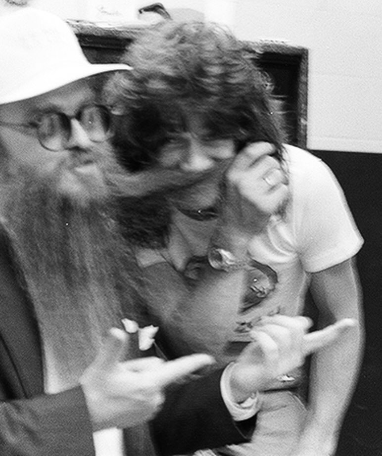 historyrock_'s tweet photo. Eddie Van Halen and Billy Gibbons met when they were both living nearby in Los Angeles, in the years following Van Halen’s debut in 1978. 

Gibbons, already an established star with ZZ Top, had been blown away the first time he saw Eddie play live, immediately recognizing the revolutionary nature of his guitar technique.

What truly brought the two guitarists together, beyond music, was something much simpler. Their shared passion for Mexican food. From that everyday affinity, a genuine friendship was born that lasted for decades, fueled also by the mutual respect between two of the most innovative styles in the history of the electric guitar.

Backstage photos like this one, showing the two sharing laughter and jokes away from the stage, capture precisely that genuine closeness between two rock legends.