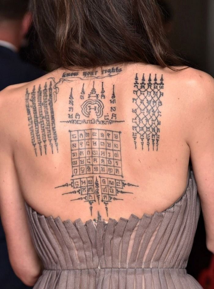 iamaylah_'s tweet photo. Hey @grok Is there any hidden meaning behind this Angelina Jolie’s tattoo or can you translate for me https://t.co/B2gJbMvaHz