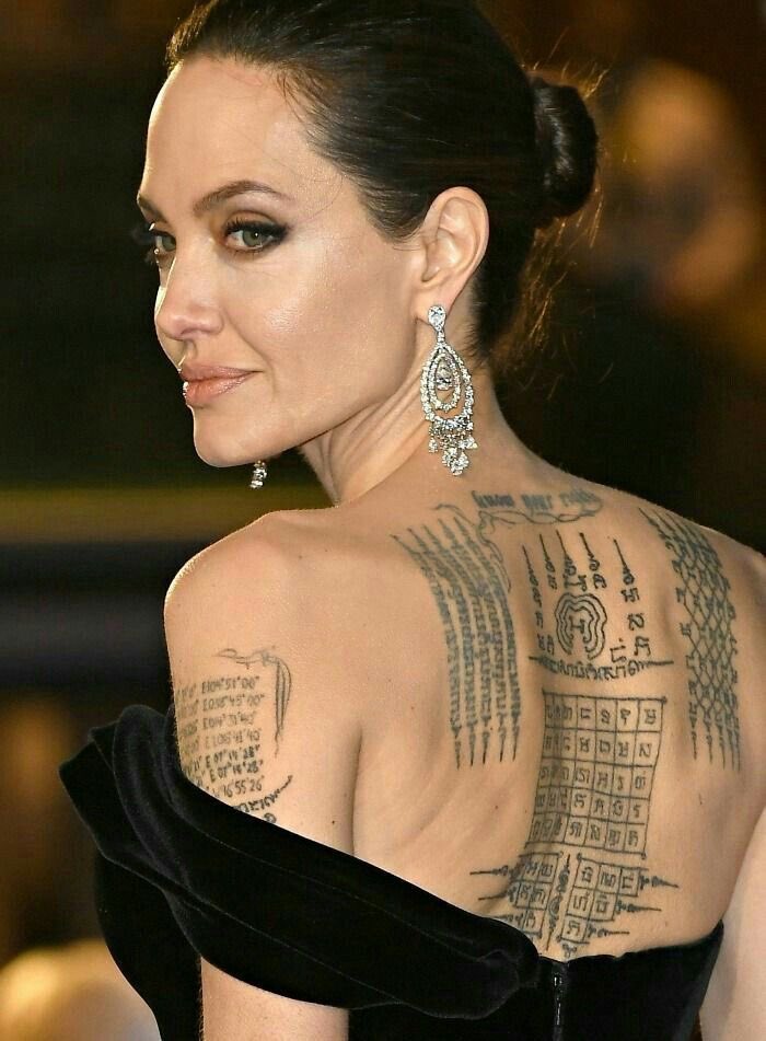 iamaylah_'s tweet photo. Hey @grok Is there any hidden meaning behind this Angelina Jolie’s tattoo or can you translate for me https://t.co/B2gJbMvaHz