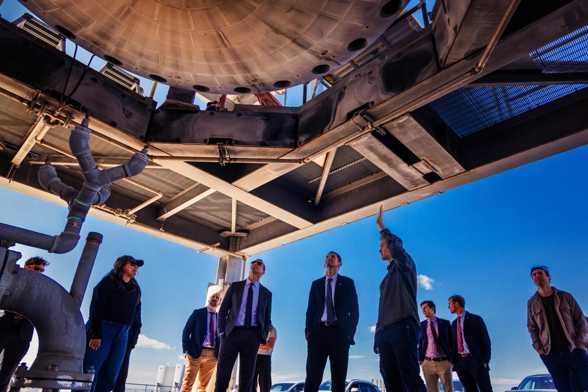 NASA Administrator Jared Isaacman, Stoke Space CEO Andy Lapsa and teams from NASA and Stoke checking out an Andromeda engine on the test stand. 