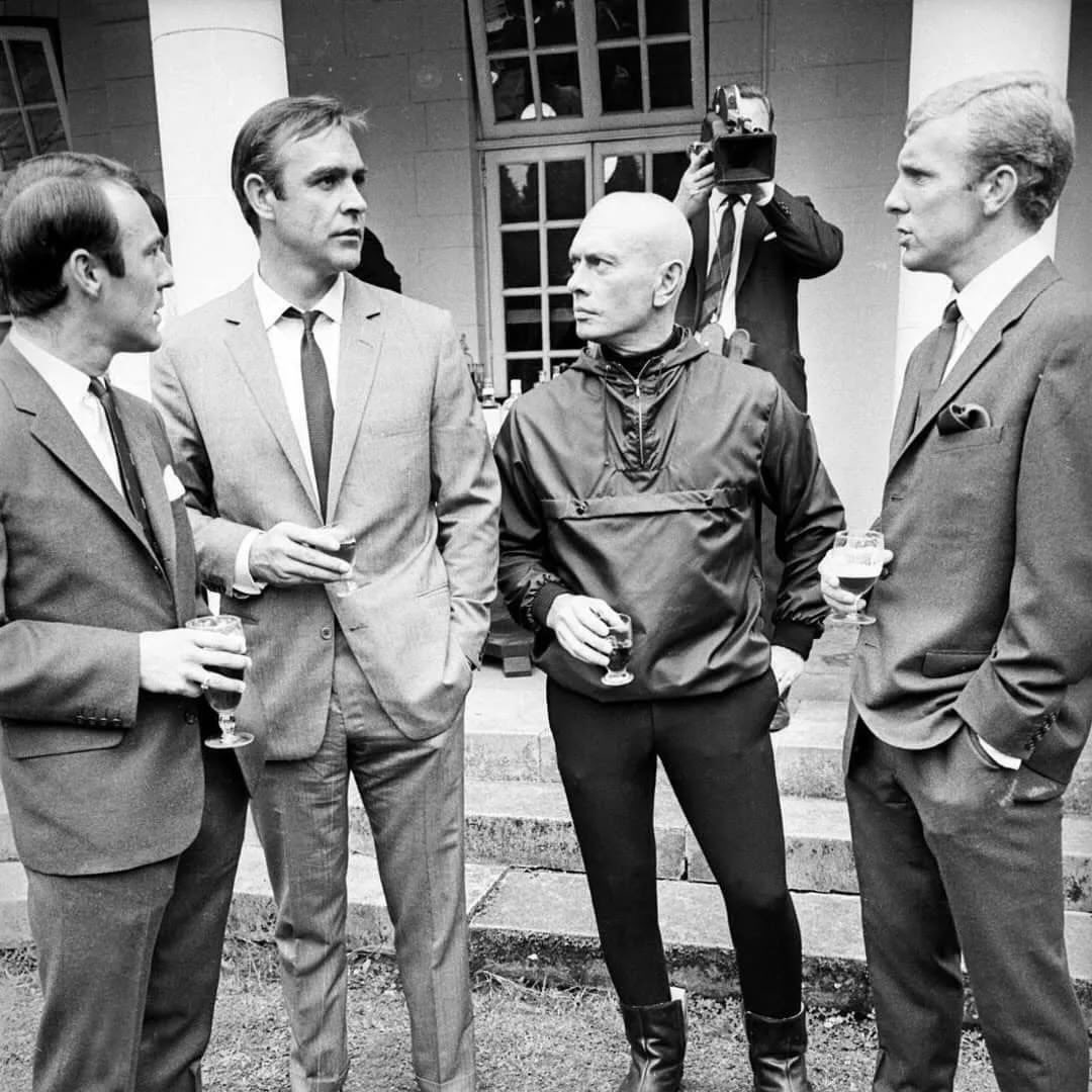 For_Film_Fans's tweet photo. Jimmy Greaves, Sean Connery, Yul Brynner and Bobby Moore during a visit by the England football team to Pinewood Studios in 1966. https://t.co/vyotvg1JtO