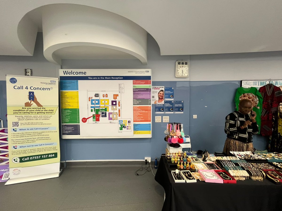 Fremond_'s tweet photo. Why is there an African woman selling bags and beads in the lobby of an NHS hospital. https://t.co/PFfkaW8Xze