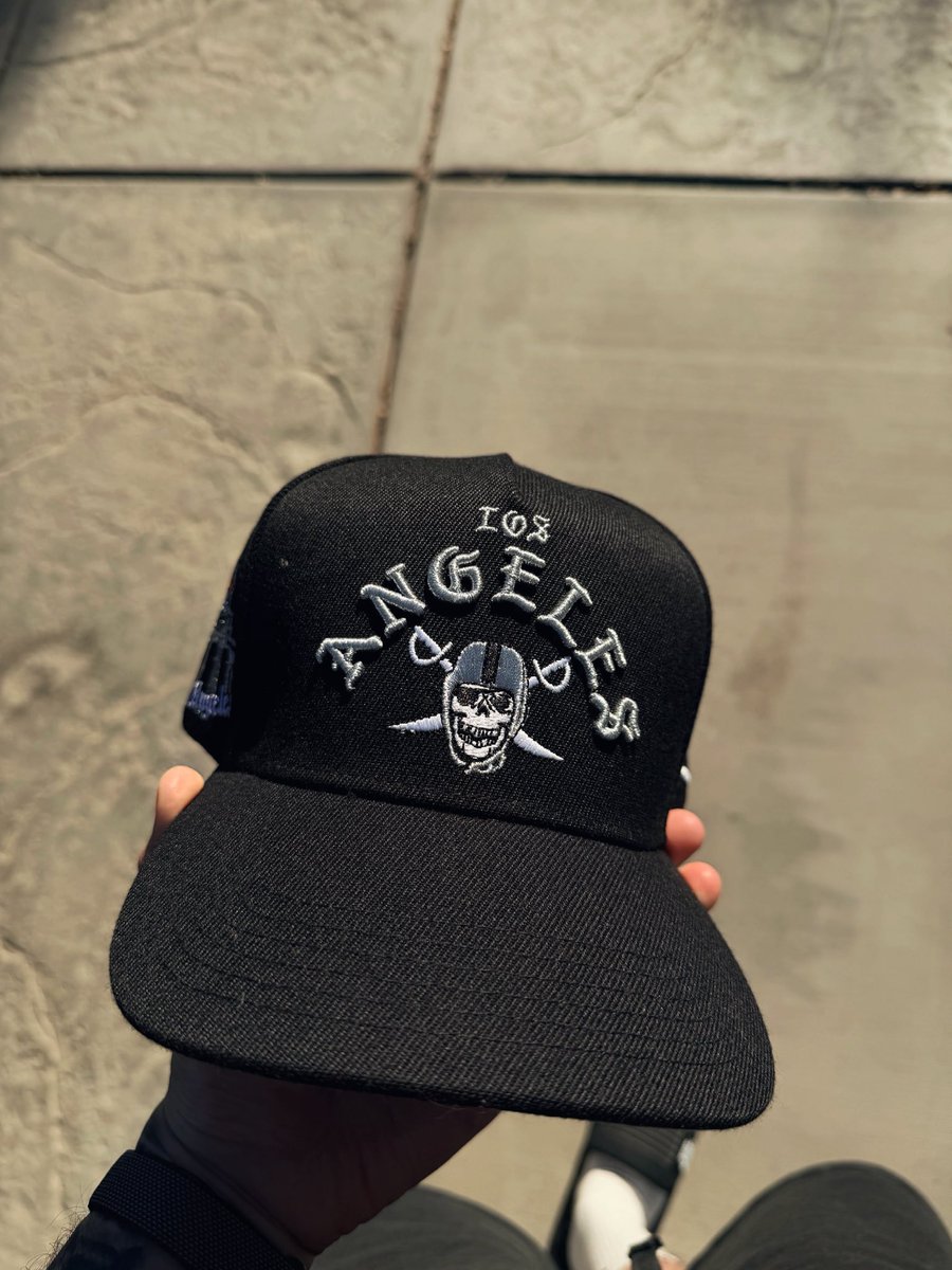 TheNAT1ON_'s tweet photo. Most of our LA tees gone, but tap in with our LA hat 🏴‍☠️🔥 we all know who runs the city. https://t.co/RKEgWfEmQ5