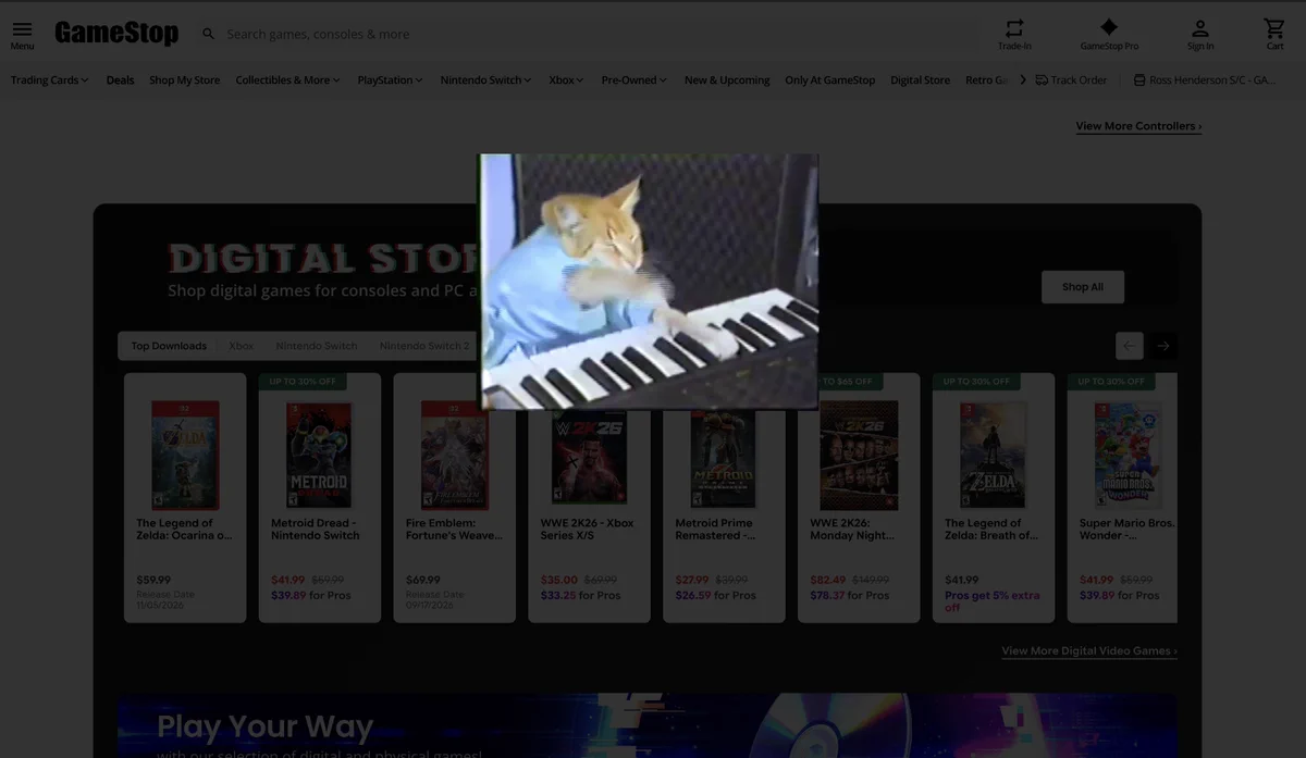 Keyboard Cat playing over the GameStop website