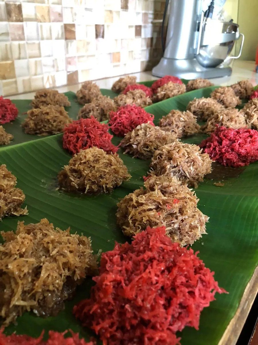 got_cake's tweet photo. Do you know what this is?
The sweet traces its history back to the 17th and 18th centuries during the proliferation of sugarcane plantations across the Caribbean, especially islands like Barbados 🇧🇧  and Tobago 🇹🇹.

Enslaved Africans and their culinary innovation combined abundant local ingredients—such as indigenous coconuts—with the byproducts and surplus of sugar production to create affordable, long-lasting, and nourishing treats.
 Passed down through generations, the recipe became a staple of Caribbean culinary heritage and a nostalgic favorite for schoolchildren across the Caribbean.
This is cultural legacy and is found in an array of colors wherever sugarcane was a king crop.

What do they call this in your favorite Caribbean region?