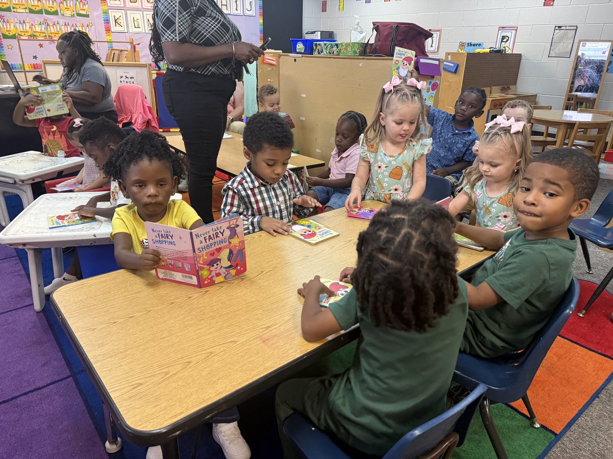 PowderSpringsES's tweet photo. Mr. Moore, Brown/Knowles, &amp; Sutton/Jean-Baptiste had some fun with our Pre-K friends reading some new sensory books 👆🏾#📖. These smiling faces were all into their books and the fun unicorn hair, gnome beard, and troll hair they could touch 🎉 https://t.co/DZqW0I9sFR