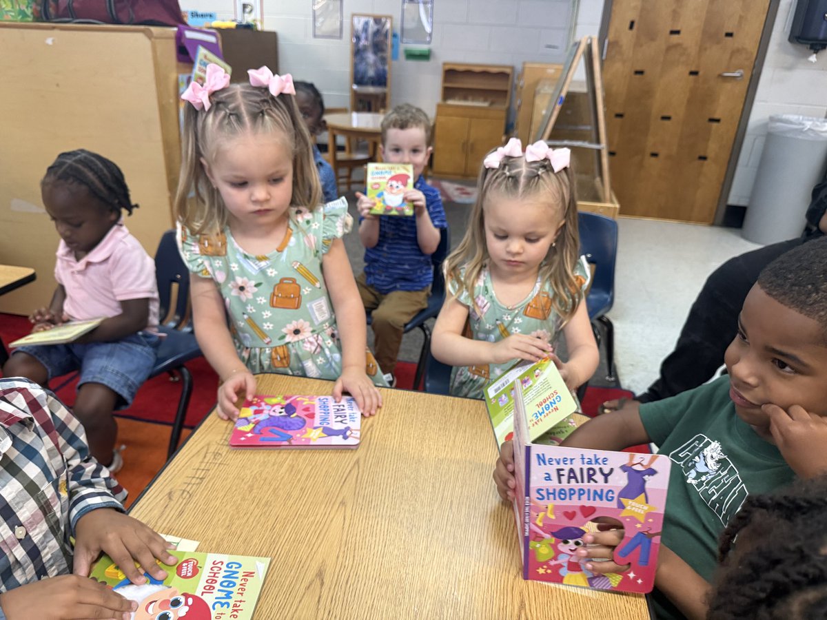 PowderSpringsES's tweet photo. Mr. Moore, Brown/Knowles, &amp; Sutton/Jean-Baptiste had some fun with our Pre-K friends reading some new sensory books 👆🏾#📖. These smiling faces were all into their books and the fun unicorn hair, gnome beard, and troll hair they could touch 🎉 https://t.co/DZqW0I9sFR