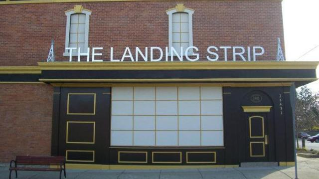 OfficerSLeone's tweet photo. Nothing better after a long shift than visiting The Landing Strip. His cousins definitely got into the right business. https://t.co/86Z3jkV2II