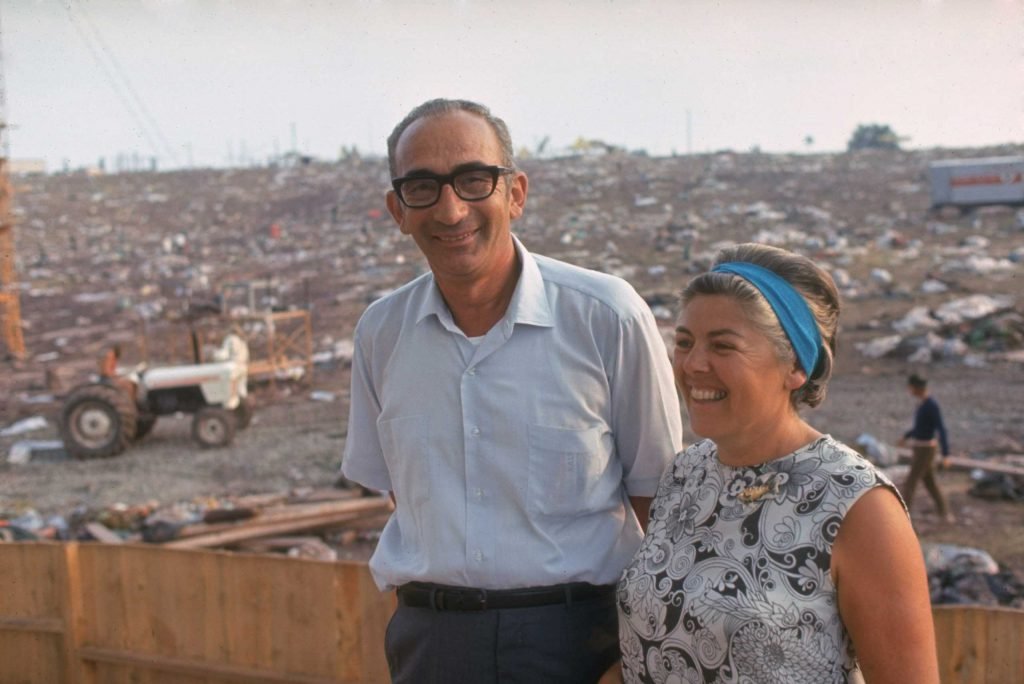 EchoesofWarYT's tweet photo. Max and Miriam Yasgur on their land after the Woodstock Music &amp; Art Fair, August 1969. https://t.co/xrWOVVyadR