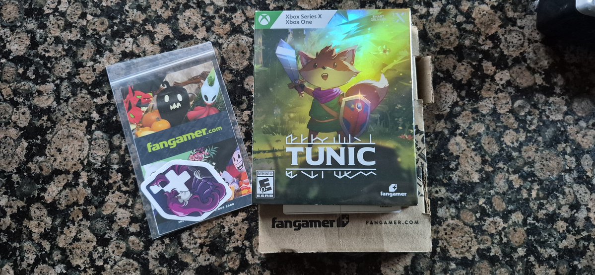 Apollokid3000's tweet photo. My @Fangamer package came in today. TUNIC!!!! I love this game. I first discovered it through Xbox Gamepass. I have bought it 4 times. On PS4, Switch, PC and now XBOX. @FinjiCo made a wonderful game. The XBOX version is Xbox Play Anywhere and in the disc to digital program. https://t.co/y1Gf5KiGEX