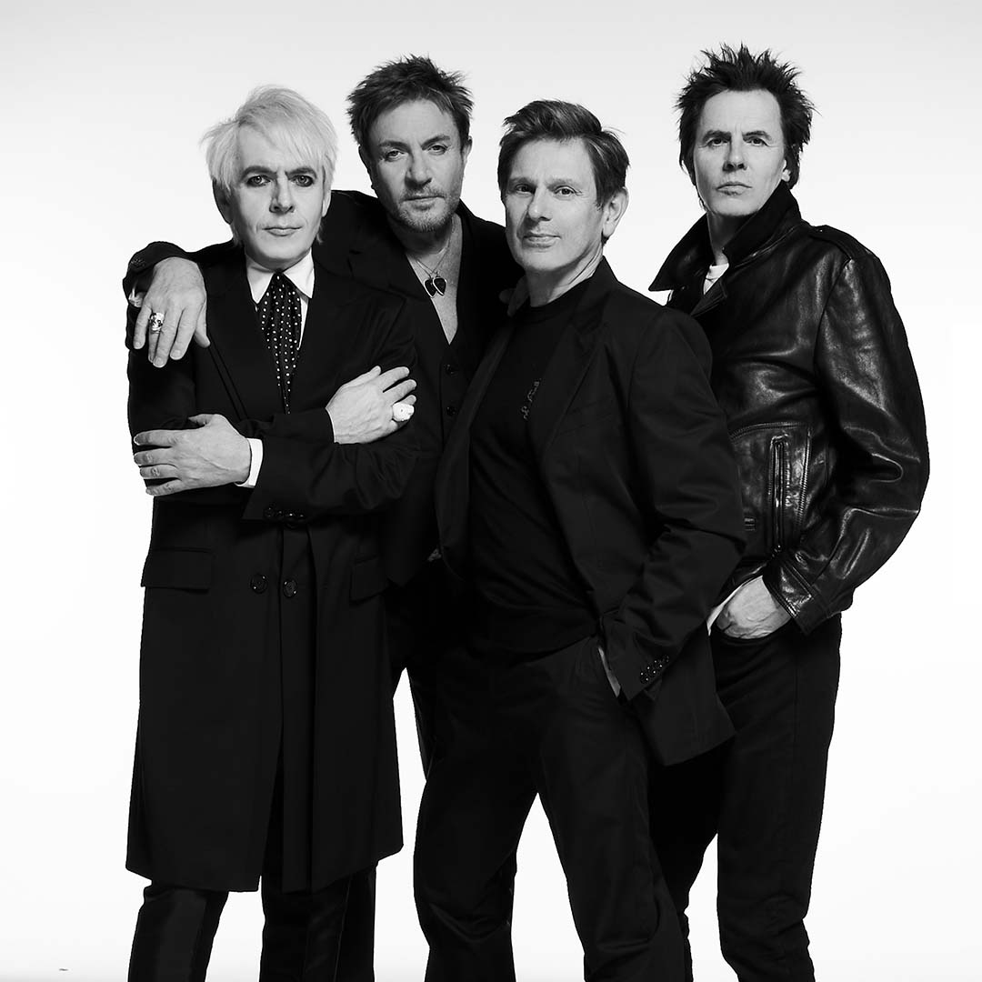 press shot of band members of duran duran stood side by side.