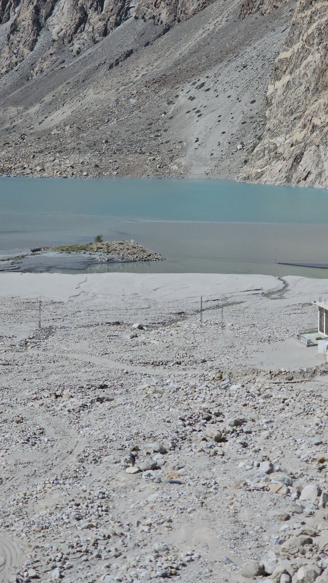 hnaqikhan's tweet photo. visited the Luxus Grand Hotel site at Attabad Lake. Before it was built, we warned that this was the wrong place: a hotel on a lake created by a massive landslide, sitting in the path of the Annah nullah that brings water, mud and boulders down the mountain.
Those floods came. The building was damaged. By God’s grace there was no casualty.
I was told that the owner has now sold it to a junk contractor who will demolish it and sell the material — for eleven crore rupees, as reported.
This is not just one hotel. It is what happens when we ignore natural drainage, fragile slopes and disaster history for short-term tourism revenue.
Watch my video from the site. We must rethink where and how we build. Nature has to be part of the plan.
#Attabad #Hunza #ClimateResilience #WWFPakistan