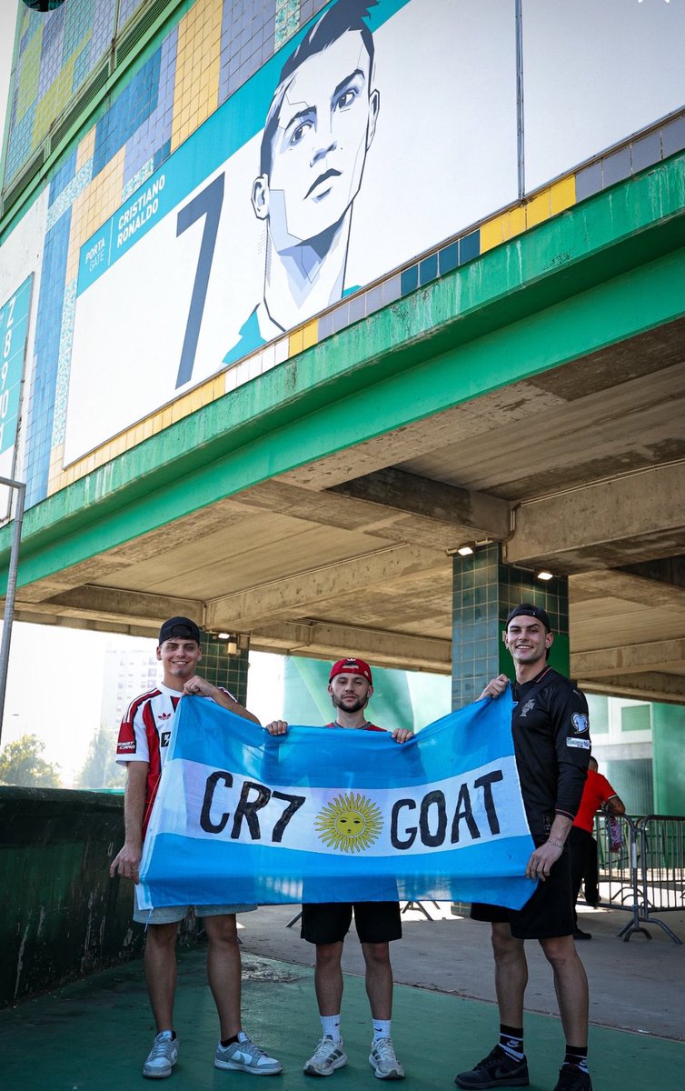 NoodleHairCR7's tweet photo. Argentina fans holding the flag "CR7 GOAT" ahead of Portugal v Wales 🐐😂 https://t.co/SJShL67yGP