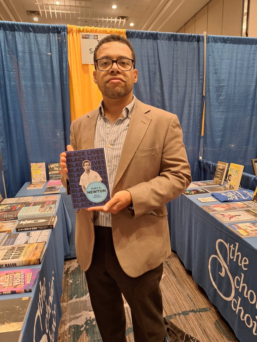 scholar_choice's tweet photo. We've had our first author sighting at @ASALH this morning--@politybooks author Delio Vasquez is pictured below with his book Huey P. Newton: I Am We.  #asalh2026 https://t.co/zXApeUTmO1