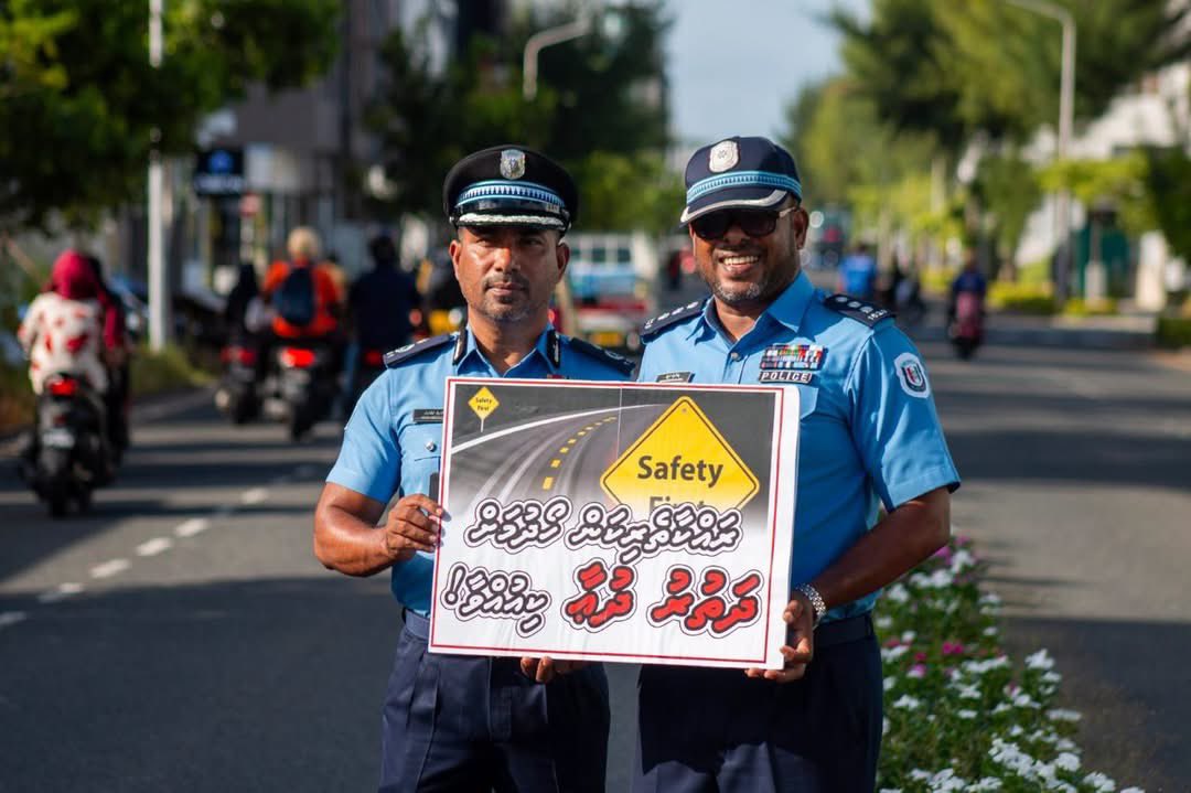 PoliceMv's tweet photo. Our officers from Hulhumale Police conducted a silent campaign to raise awareness about road safety this morning along Nirolhu Magu in Hulhumalé Phase 2.

Using simple yet impactful messages displayed on placards, the officers urged road users to drive safely, remain vigilant, and contribute to accident prevention.

A few seconds of caution can save a life. Let’s work together to make our roads safer. after together.